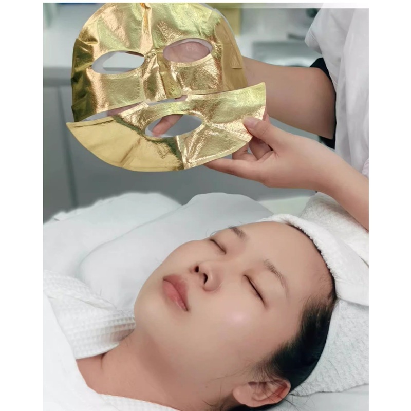 a Black Technology Heating Facial Sheet Skin Care Fabric Face Masks Gold Foil Nonwoven Mask